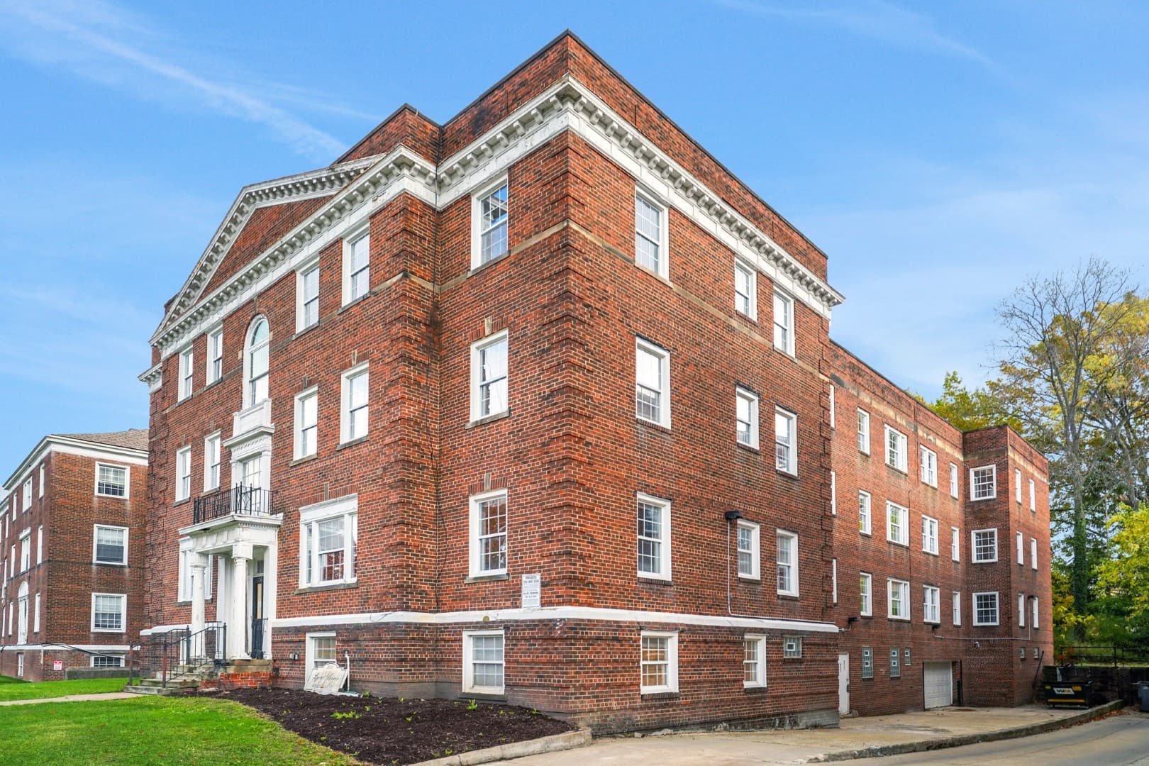 Corner view of a 1928 brick apartment building