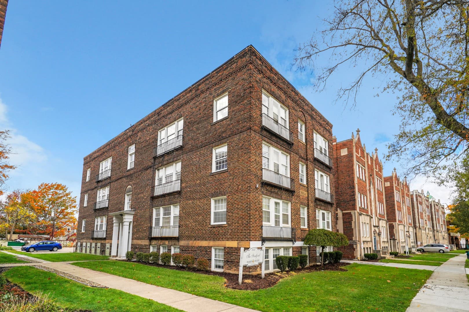 Brick apartment building with wrought-iron balconies in Shaker Square