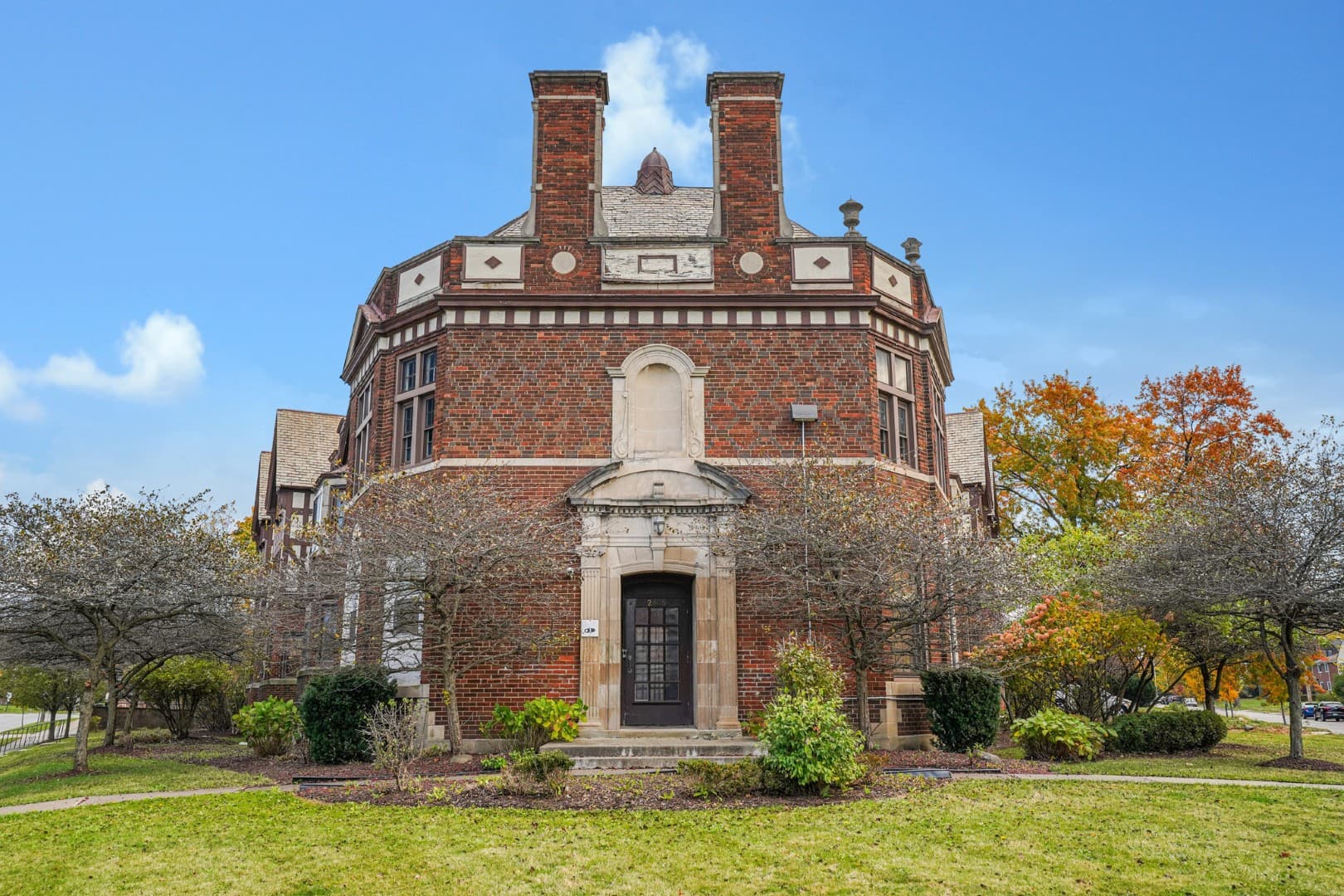 Ornate brick and stone entrance of a historic Shaker Square building